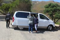 Tourists getting into the H1