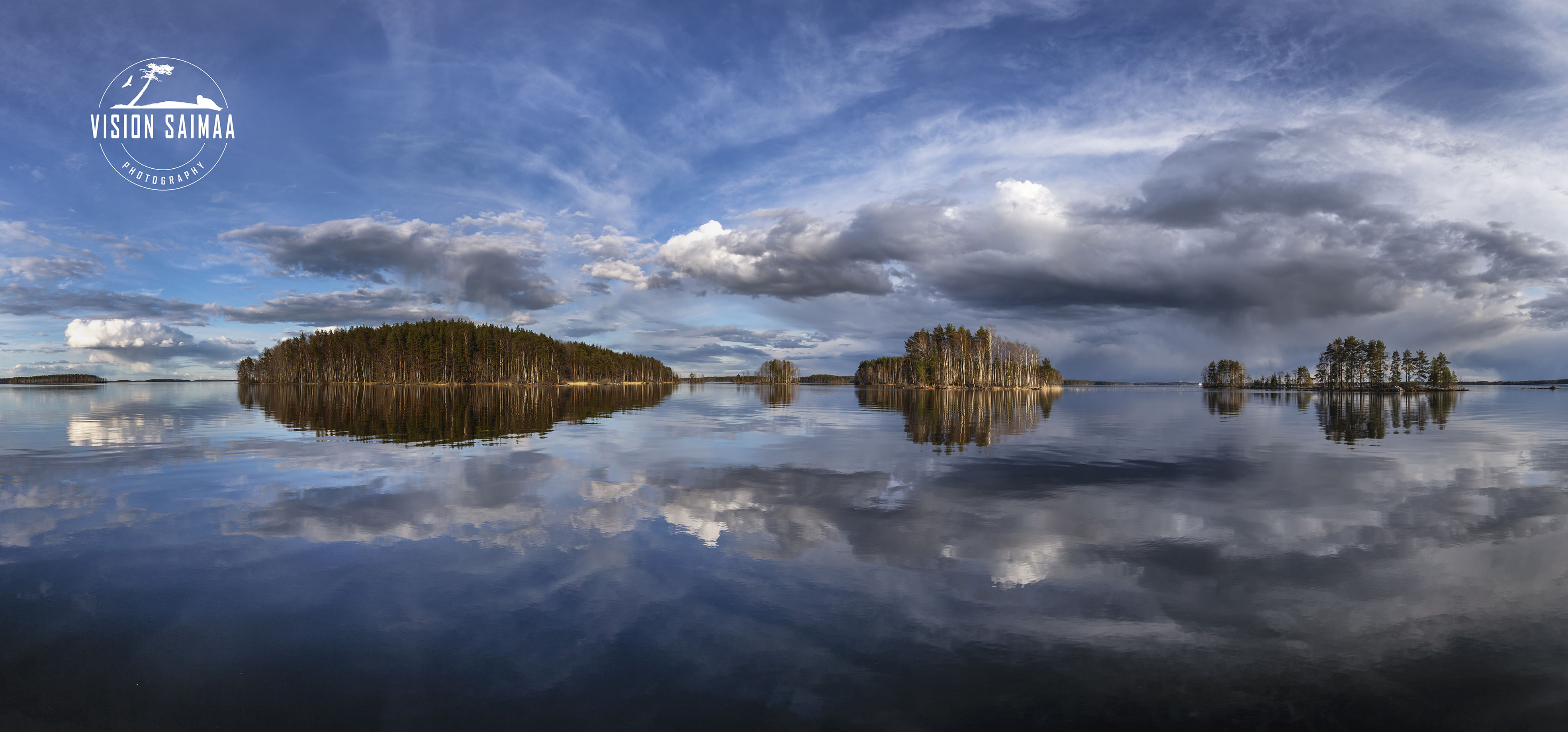 Islands reflecting from water surface on lake Saimaa