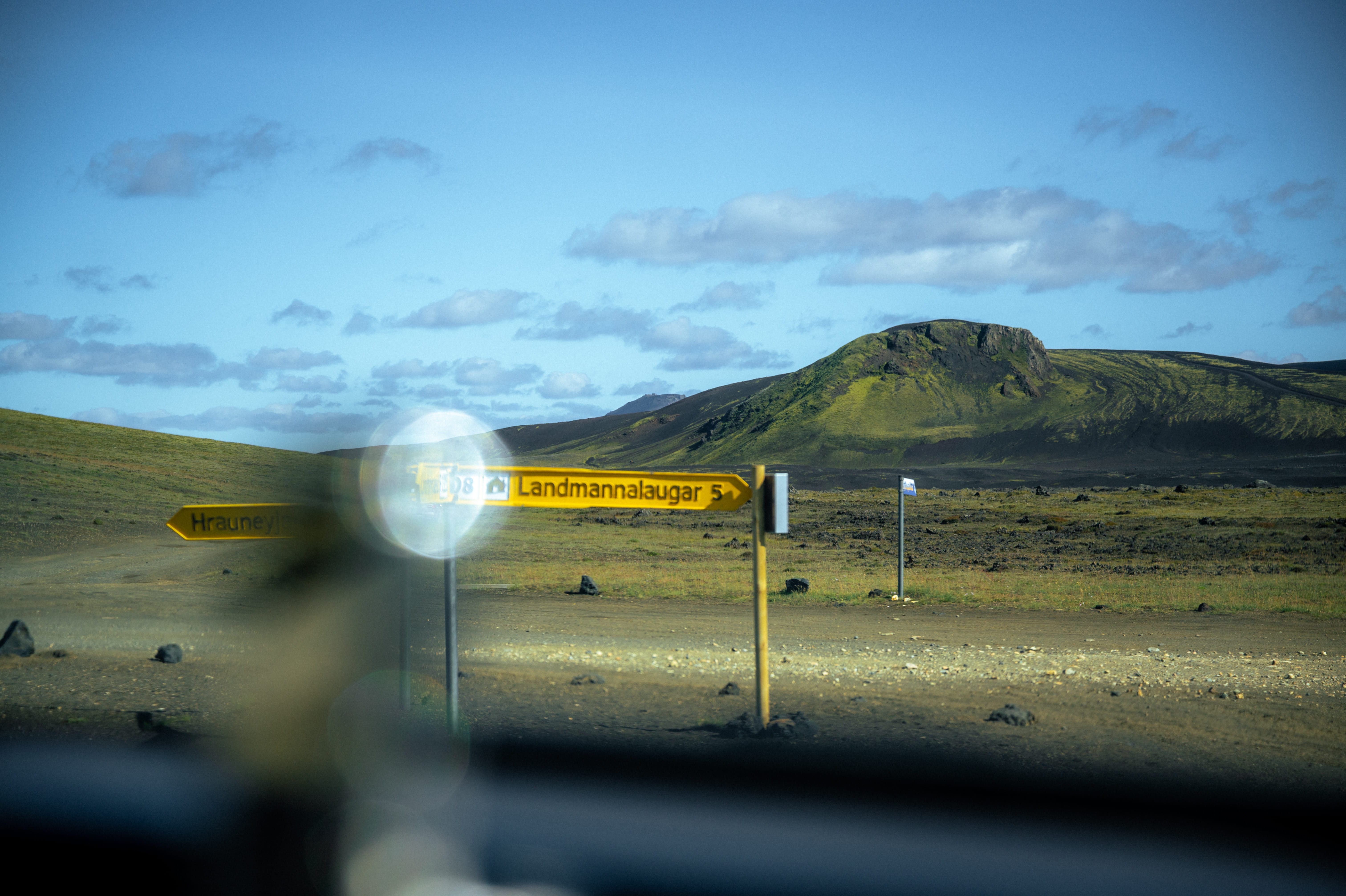 Road markers guiding the way through the rugged terrain of the Icelandic highlands