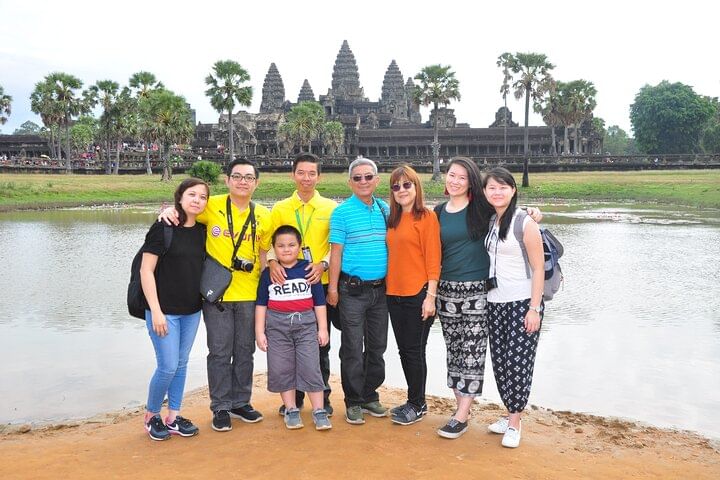 Happy group of travelers exploring Cambodia together on a private guided tour