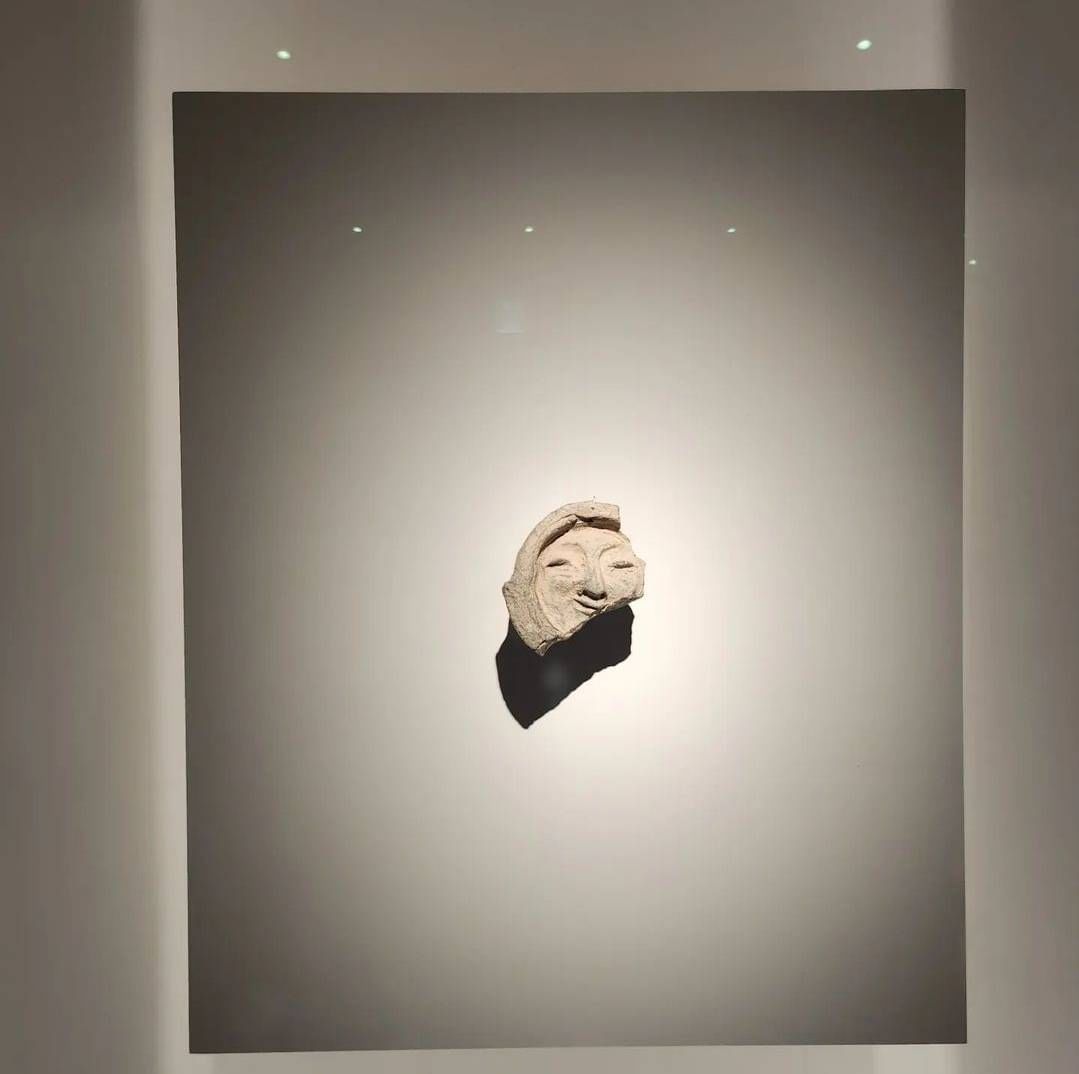 Stone Buddha head known as the “Smile of Silla” displayed at the Gyeongju National Museum.