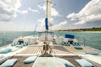 ChatGPT said: Enjoy a scenic catamaran cruise with spacious sunbathing decks and stunning views of the turquoise sea.