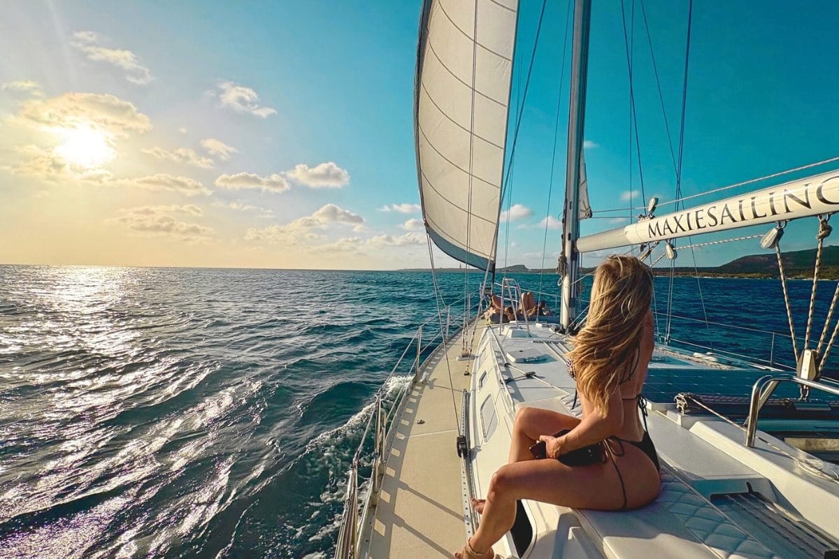 Beautiful woman enjoys the stunning sunset in Curacao on private tour Maxie Sailing