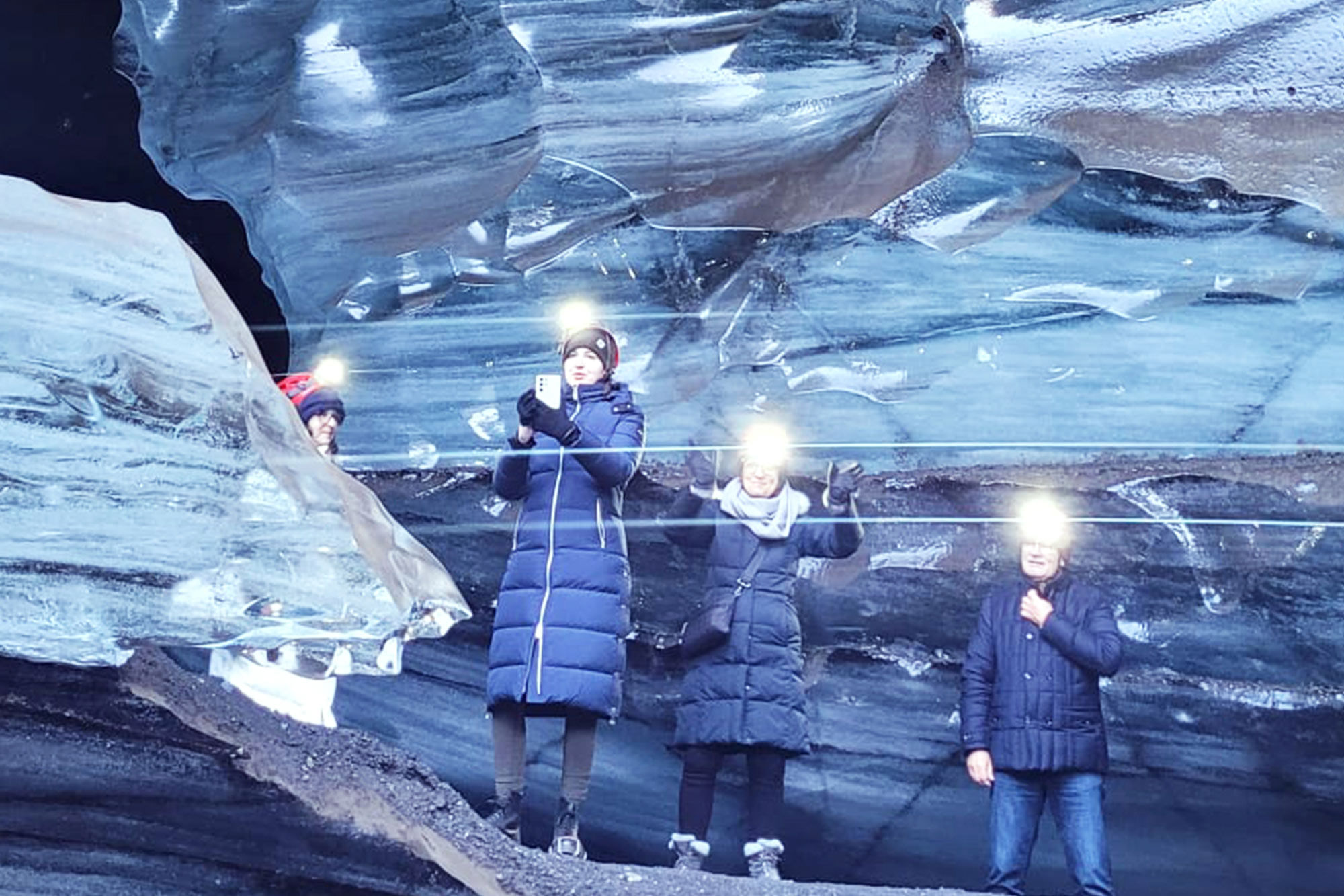 People deep inside a glacier.