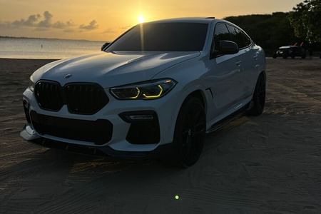 Luxury BMW X6 Transfers in San Juan with Champagne and Insider Tips