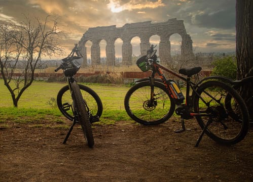 One-Day WOW Private Experience with Biking, Lunch, Golf Cart Tour, VIP Colosseum Access and Rooftop Aperitivo