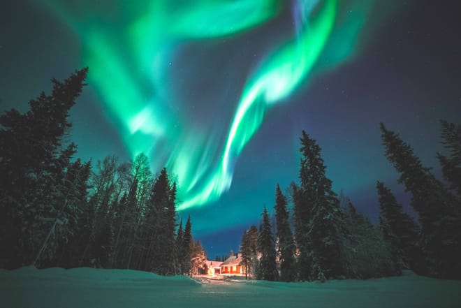 Searching for Northern Lights by Snowmobile