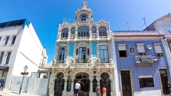 Art Nouveau Museum facade in Aveiro with ornate windows, tiles, and pedestrians
