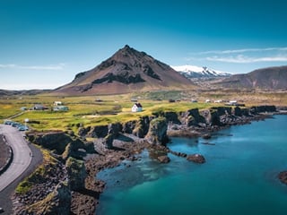 The picturesque town of Arnarstapi nestled on top of impressive cliffs on the southern side of the Snæfellsnes Peninsula