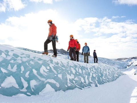 Small group hiking on glacier during 2 day south coast tour Iceland
