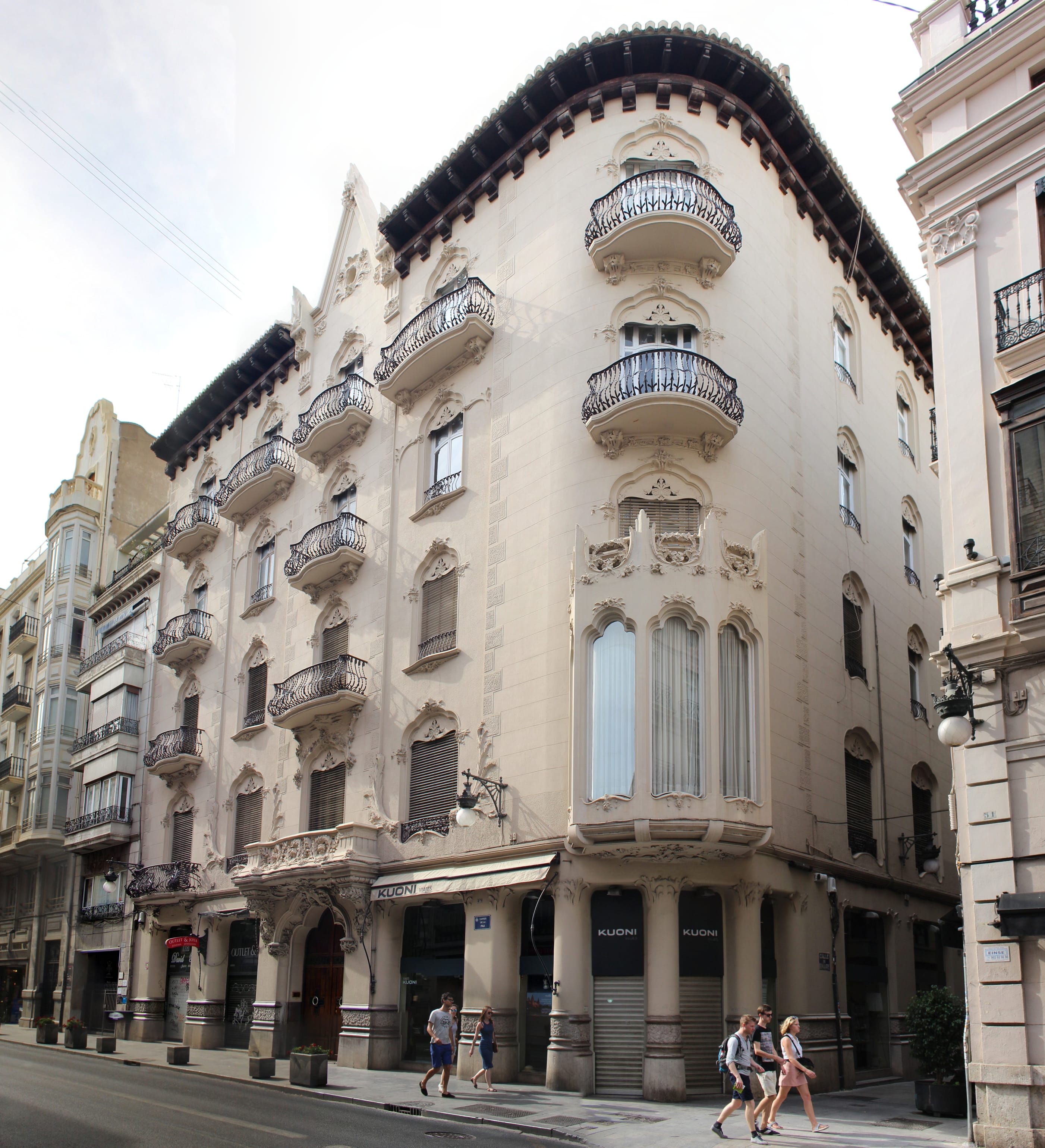 Historic modernist building with ornate balconies and elegant architecture in central Valencia