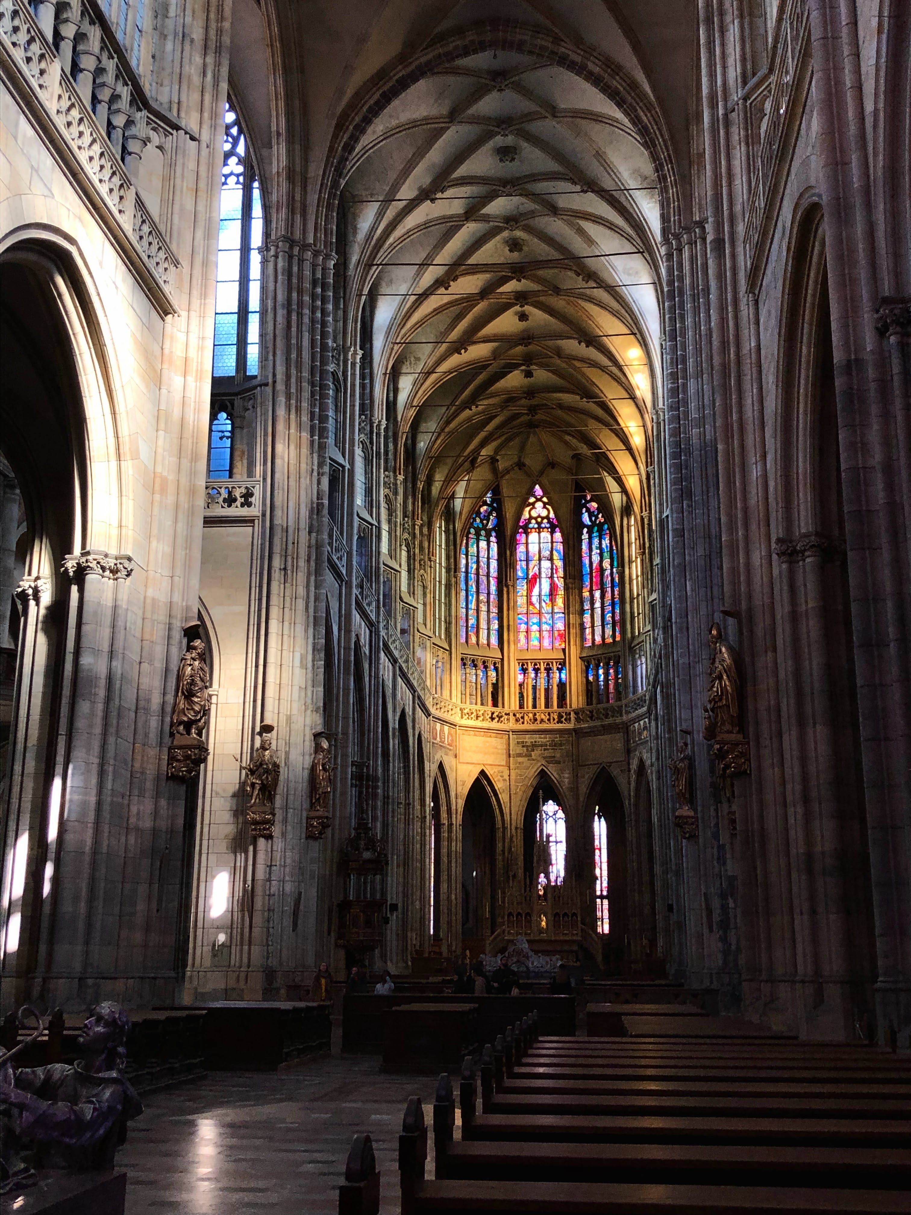 Interior of St. Vitus Cathedral with stained glass windows
