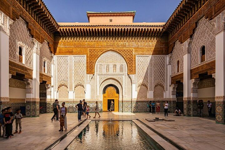 The Ben Youssef Madrasa in Marrakech is a 16th-century Islamic school known for its stunning architecture, featuring intricate carvings, tilework, and a large courtyard. It once housed students and is