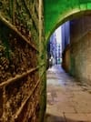 An empty narrow back alley in the historic center of Barcelona - off-the-beaten-track