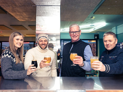 Guests enjoying locally crafted beer