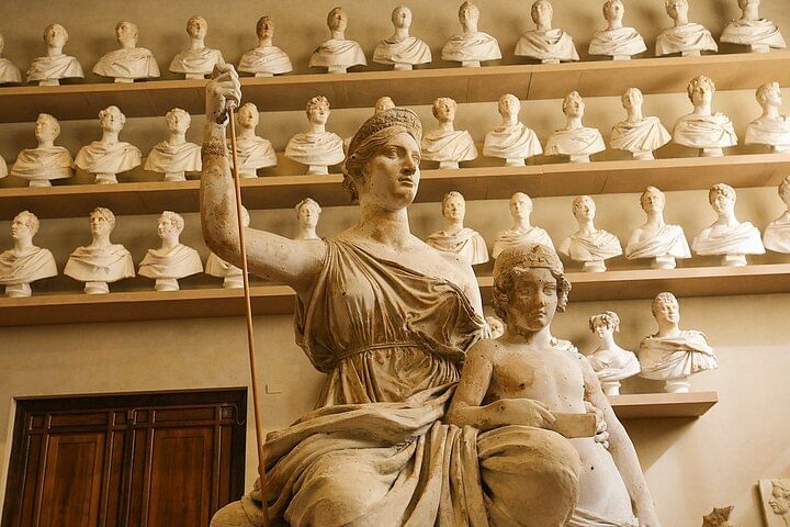 Close-up of one of the sculptures inside the Accademi Gallery, with many marble scukptures in the background