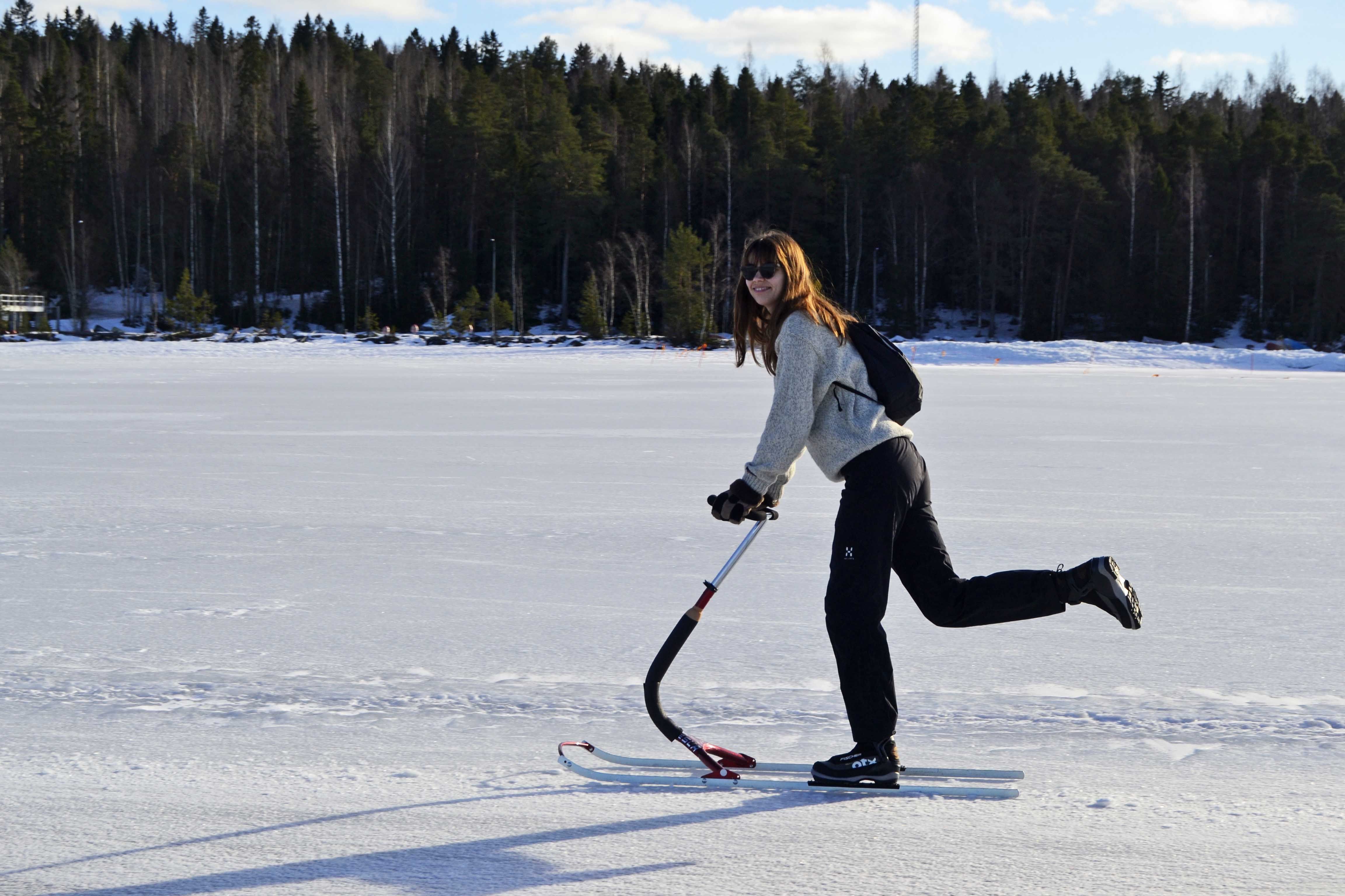 Kick-sledding on lake ice