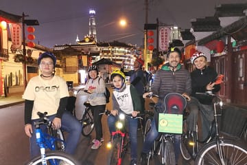 Shanghai Night Cycling Tour with Food and Skyline Views