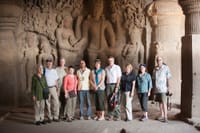 A group of American tourists touring the Ellora cavess.
