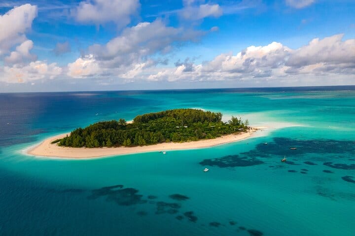 Explore Mnemba Island’s turquoise waters, snorkel over colorful coral reefs, and enjoy drinks and lunch on this unforgettable full-day adventure!