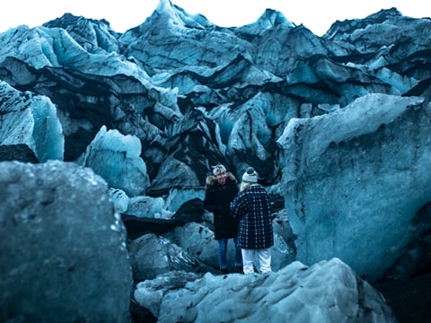 Having a laugh amongst the elements at Seljalandsfoss waterfall Iceland