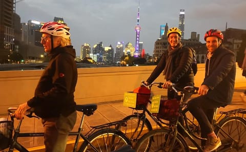 Shanghai Night Cycling Tour with Food and Skyline Views