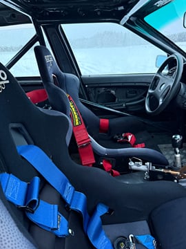 Driving a rally car on an ice track 1h .