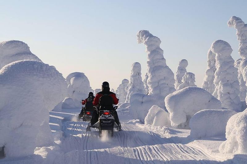 Snowmobiling to Kuntivaara hill at Kuusamo
