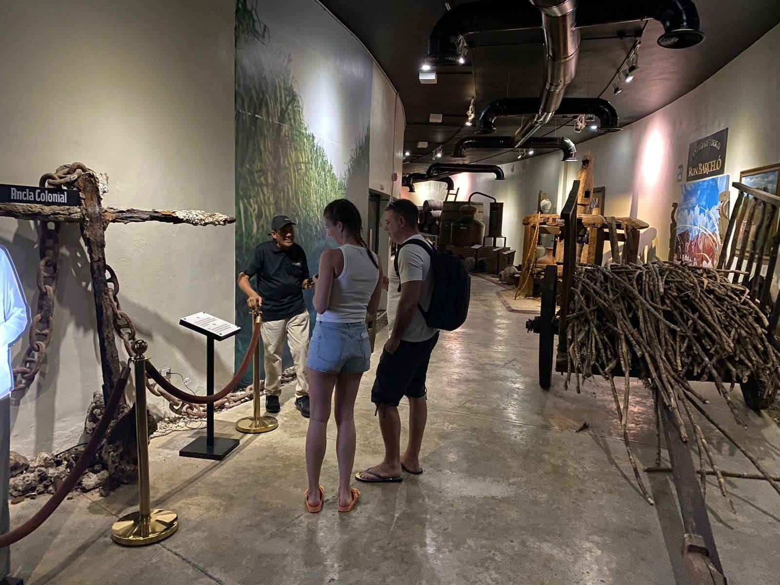 Couple of visitors watching historical exhibits during the tour at the Ron Barceló Historic Center.