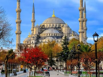 Sultanahmet’s iconic skyline — Istanbul’s historic mosque framed by warm seasonal colors.