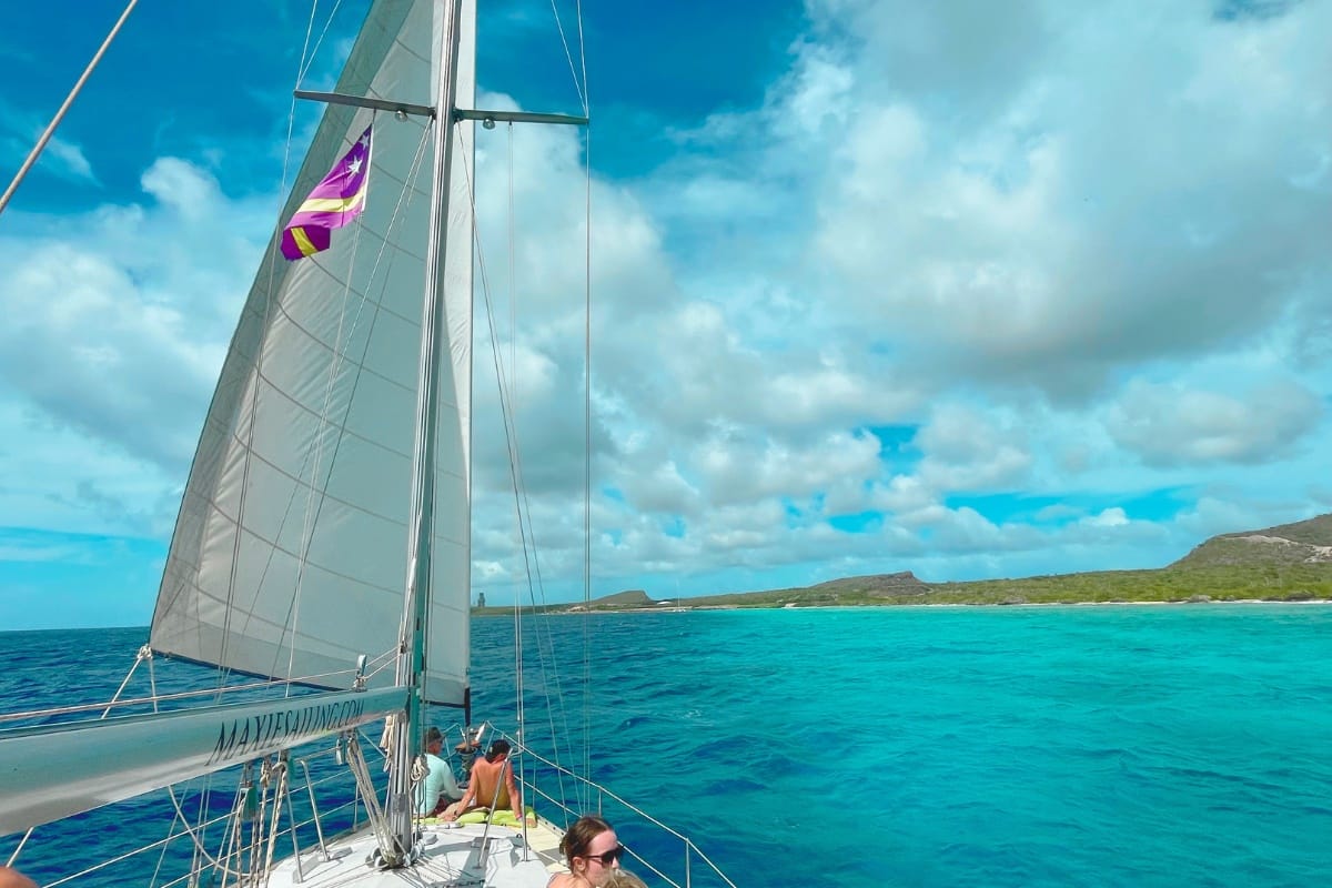 Family enjoying sailing Caribbean Sea during a lunch tour by Maxie Sailing in Curacao