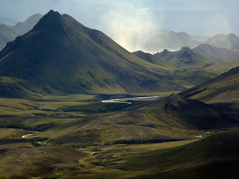 Sun, shadows and a distant rain shower. Who needs a TV on the Laugavegur Volcano Trail? Photocredits: Alastair Humphries.