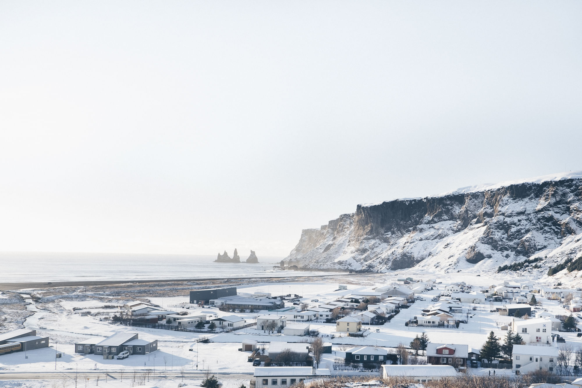 Looking over the village of Vík and Reynisdrangar seastacks