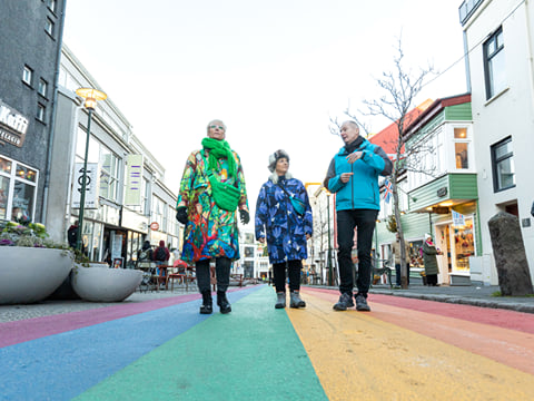 A tour group strolling down the Rainbow Street in Reykjavik