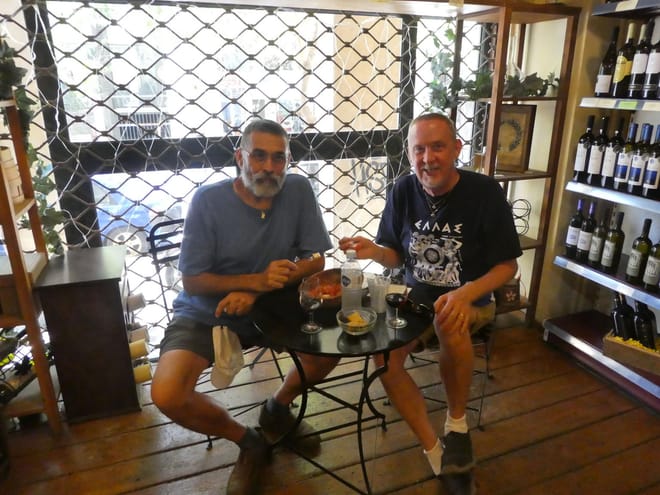 <p>Handmade Greek Salad and wine</p>