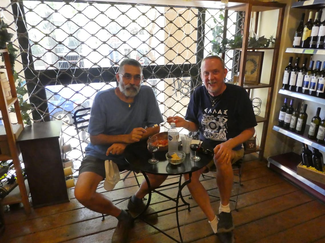 <p>Handmade Greek Salad and wine</p>