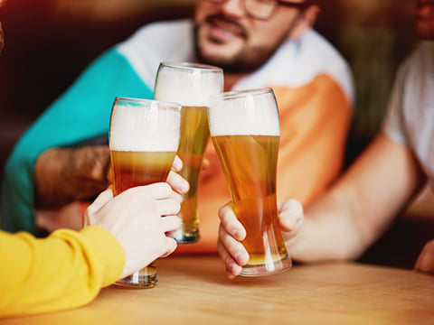 Travellers enjoying a beer together in a bar in Reykjavik