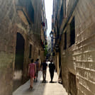 An empty narrow back alley in the historic center of Barcelona - off-the-beaten-track - at night