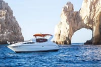 Enjoy the exclusive luxury of cruising past El Arco on your private yacht.