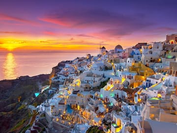 Breathtaking views over the whitewashed cliffs of Oia — where every step feels like a dream, and every glance is a postcard moment.