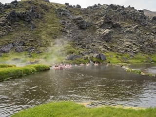 People bathing in the natural pool in Landmannalaugar