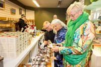 Travellers purchasing Icelandic Christmas specialities in a store