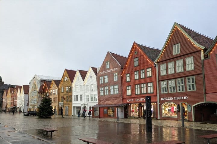 Rain falling across Bryggen's colorful wooden waterfront buildings