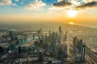 Image of Dubai skyline at sunset from Burj Khalifa SKY.