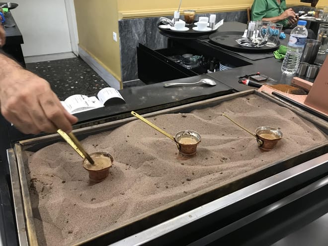 <p>Greek coffee in final stage of sand heating</p>