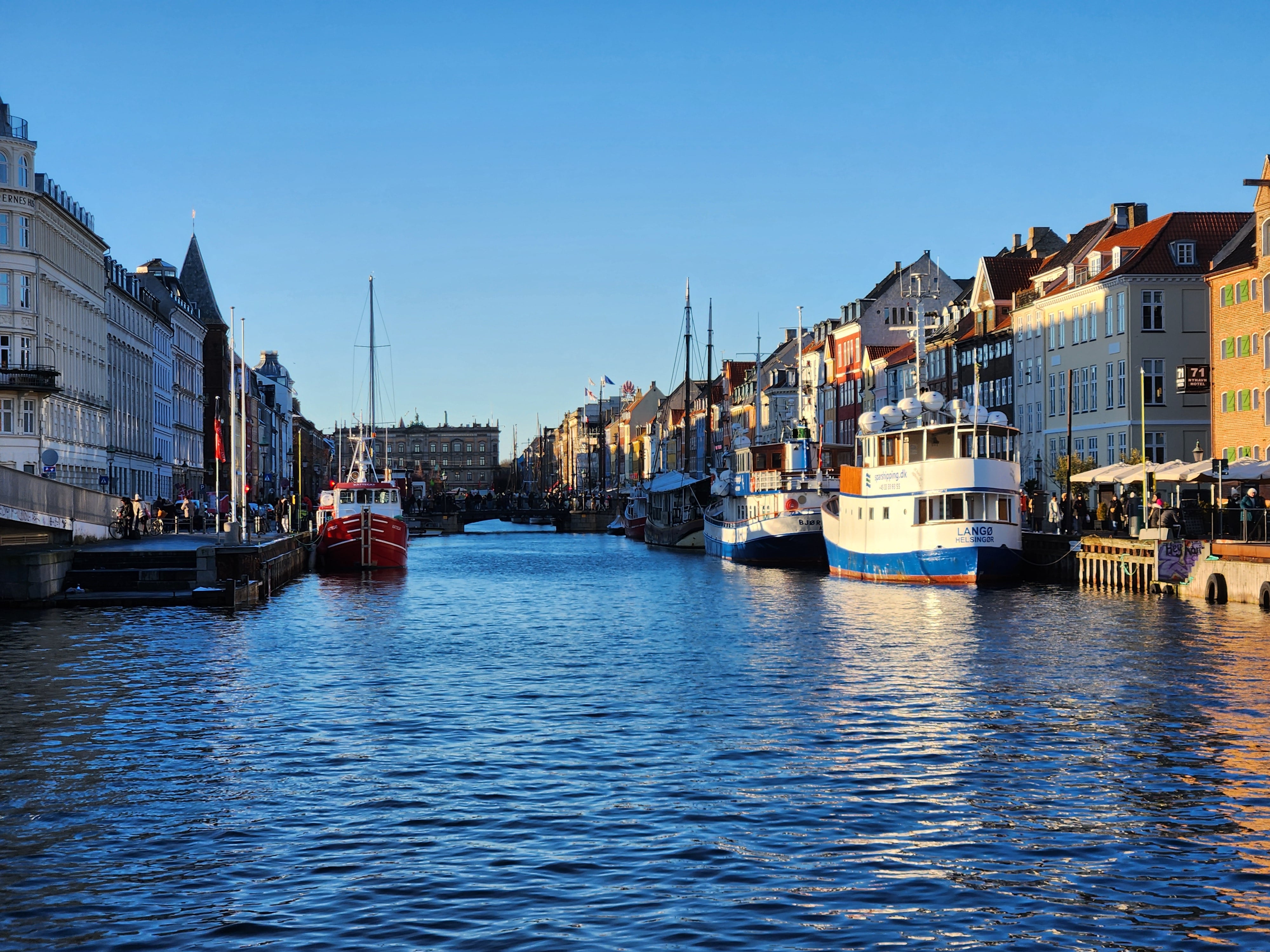A view of Nyhavns colorfull houses and house boats along the canal