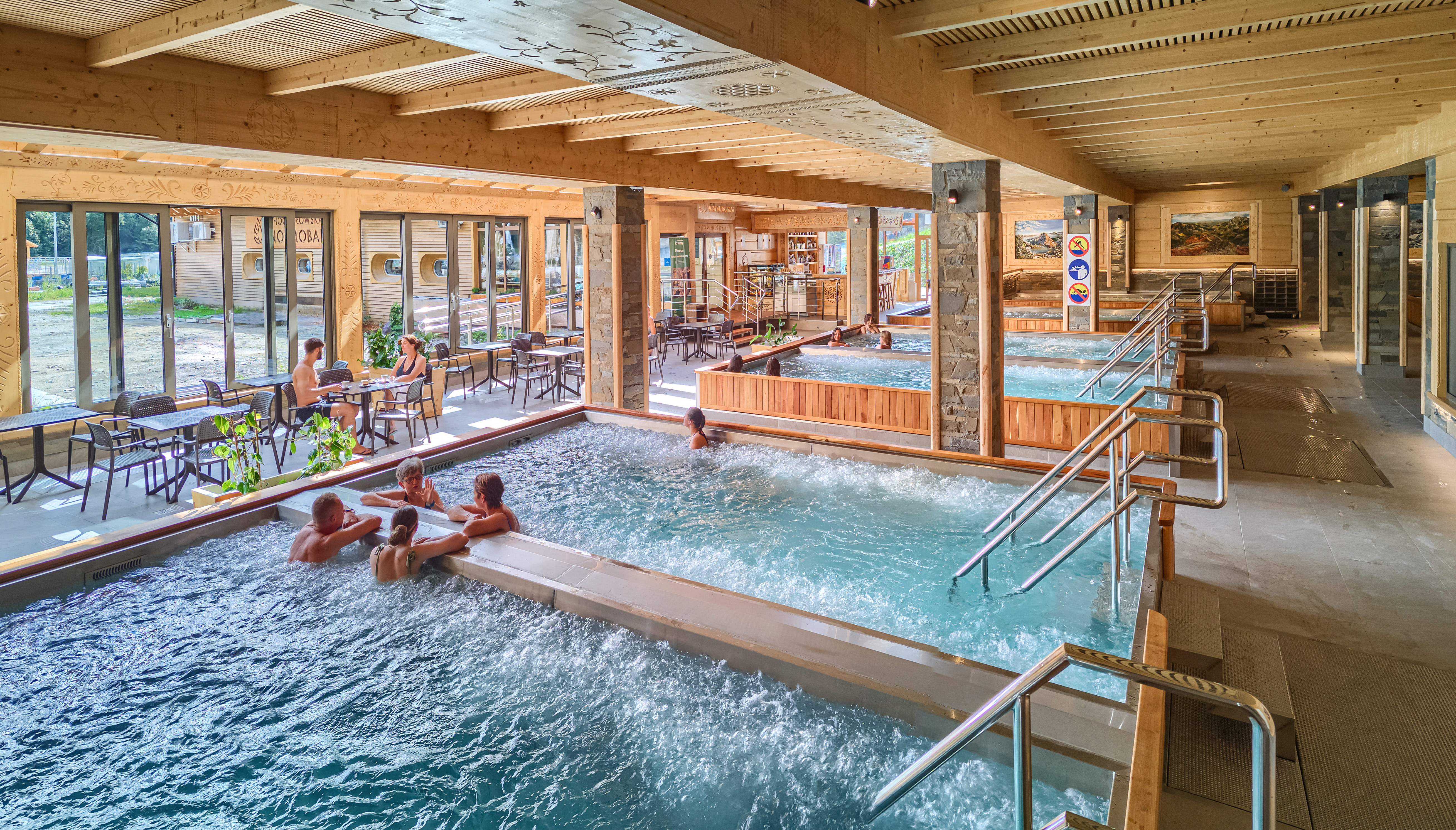 Chochołów Thermal Baths indoor hydromassage pools and bar area — mineral water relaxation Podhale