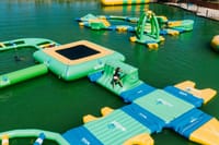 Test your agility and strength! Challenge your friends on the massive floating inflatable obstacle course at this exhilarating Punta Cana water park!