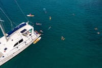 Escape the crowds and enjoy VIP aquatic fun on a private morning catamaran cruise with aquatic activities included.
