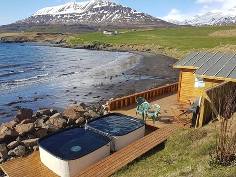 You will also find in Hauganes geothermally heated hot tubs
